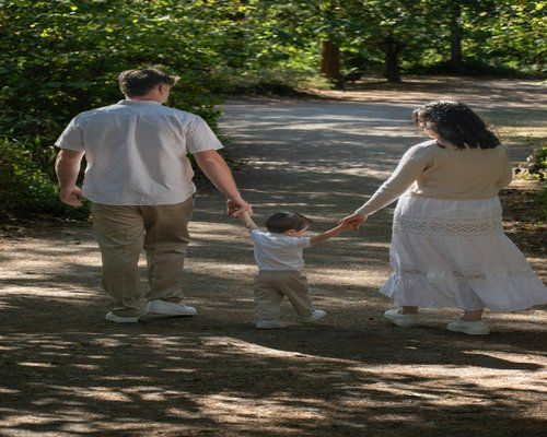 Happy family walking in a park outdoors
